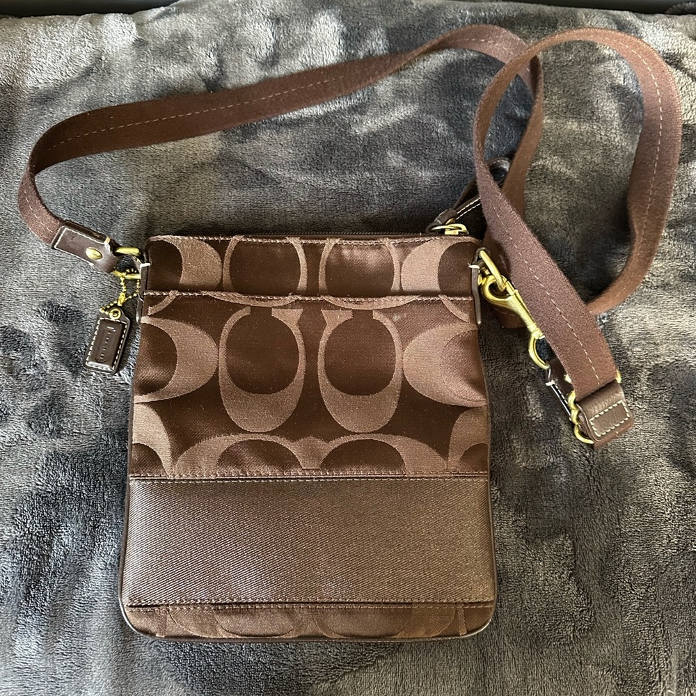 Coach signature crossbody purse.